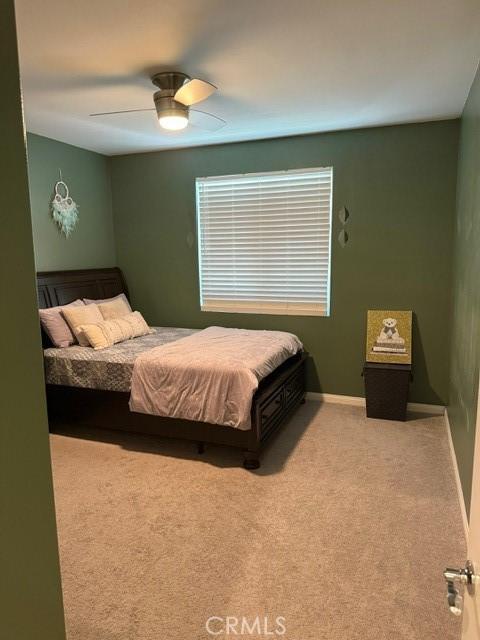 16009 Pitzer St, Fontana, CA 92336 - carpeted bedroom featuring ceiling fan and baseboards