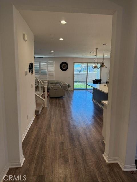 16009 Pitzer St, Fontana, CA 92336 - corridor featuring dark wood finished floors and recessed lighting