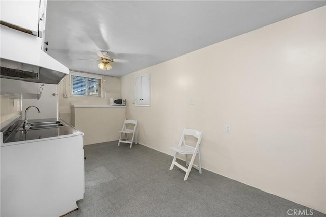 1258 N Ditman Ave, Los Angeles, CA 90063 - interior space with under cabinet range hood, ceiling fan, white cabinetry, and white microwave