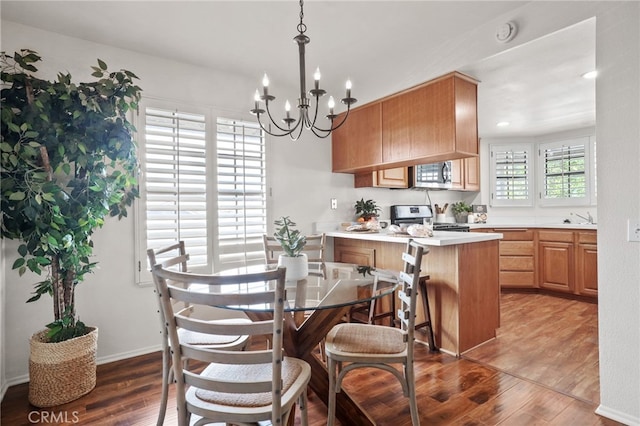 4809 Fieldbrook Ln, Cypress, CA 90630 - dining area with hardwood / wood-style flooring and a chandelier