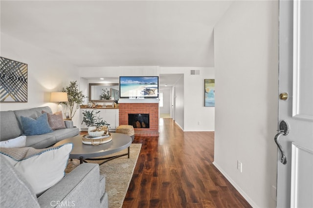 4809 Fieldbrook Ln, Cypress, CA 90630 - living area with dark wood-style floors and a brick fireplace