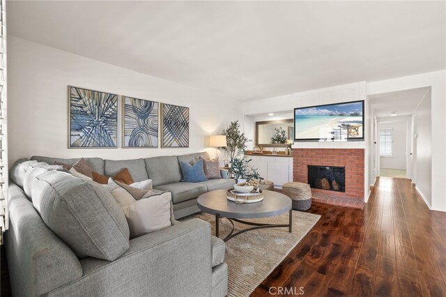 4809 Fieldbrook Ln, Cypress, CA 90630 - living room with dark wood-type flooring and a brick fireplace