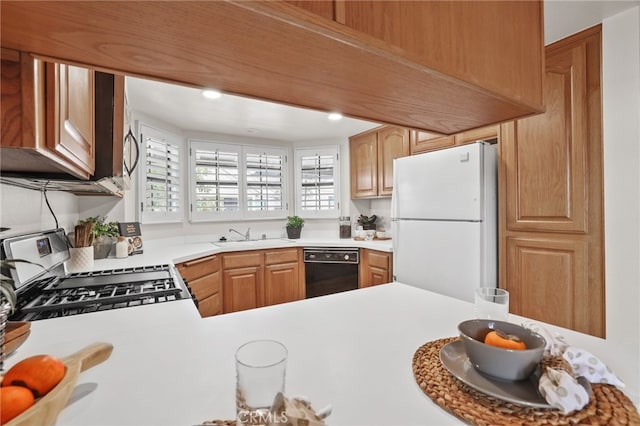 4809 Fieldbrook Ln, Cypress, CA 90630 - kitchen with freestanding refrigerator, stainless steel gas stove, dishwasher, and light countertops