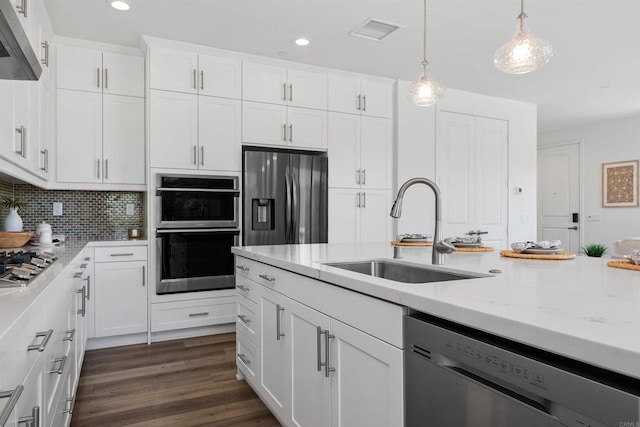 3002 Villeta Ave, Carlsbad, CA 92010 - kitchen featuring stainless steel appliances, recessed lighting, white cabinetry, light stone counters, and ventilation hood