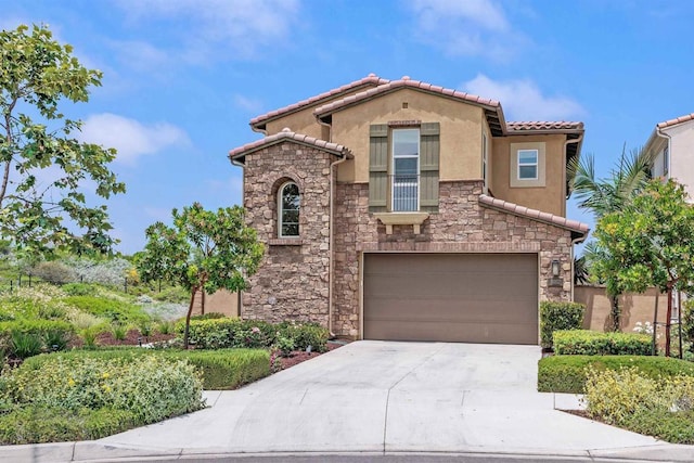 3002 Villeta Ave, Carlsbad, CA 92010 - mediterranean / spanish home with an attached garage, stone siding, driveway, a tiled roof, and stucco siding