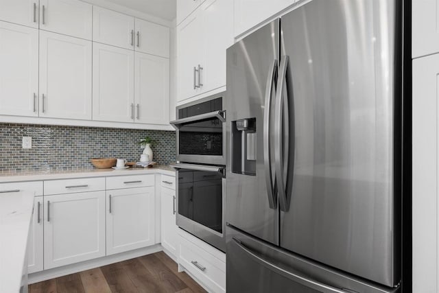 3002 Villeta Ave, Carlsbad, CA 92010 - kitchen with stainless steel appliances, light countertops, white cabinets, tasteful backsplash, and dark wood-style flooring