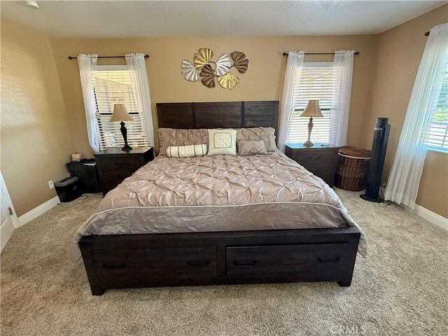 9150 Boxwood Ave, Fontana, CA 92335 - carpeted bedroom featuring multiple windows