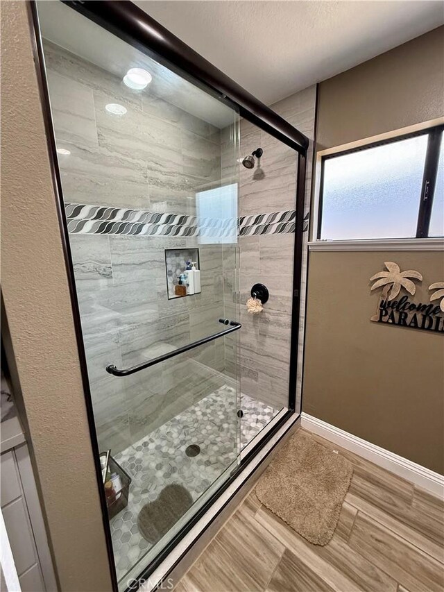 9150 Boxwood Ave, Fontana, CA 92335 - full bath featuring a stall shower and baseboards
