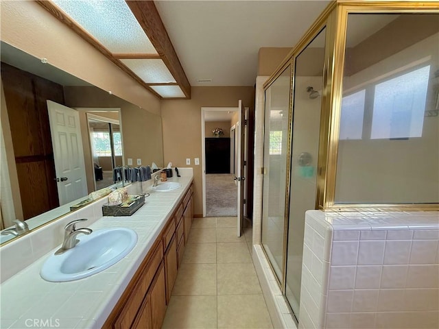 9150 Boxwood Ave, Fontana, CA 92335 - full bathroom featuring double vanity, a shower stall, and tile patterned flooring