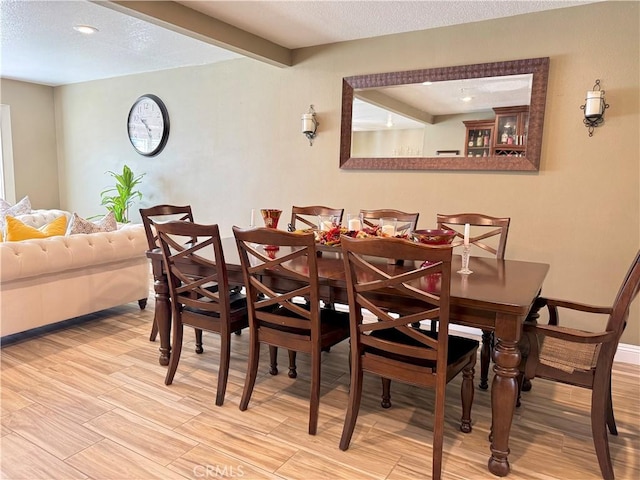 9150 Boxwood Ave, Fontana, CA 92335 - dining room with wood finished floors, a textured ceiling, and recessed lighting