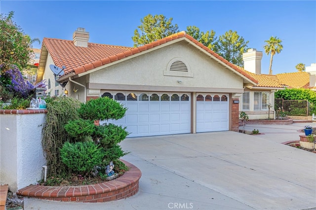 19809 Winged Foot Way, Porter Ranch, CA 91326 - view of front of property with a garage, a chimney, driveway, and stucco siding