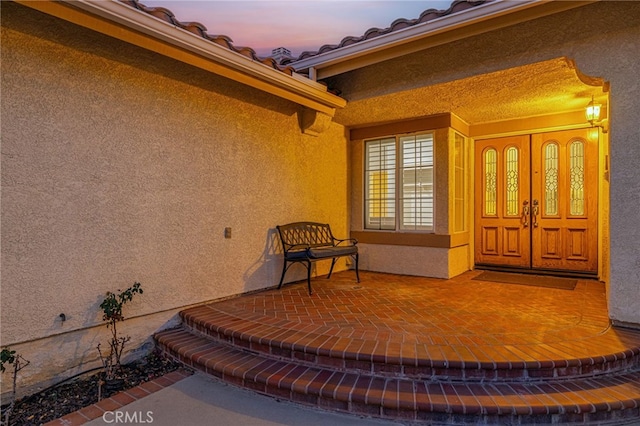 19809 Winged Foot Way, Porter Ranch, CA 91326 - exterior entry at dusk featuring stucco siding