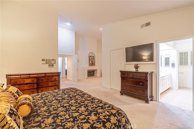 19809 Winged Foot Way, Porter Ranch, CA 91326 - bedroom with carpet floors, a high ceiling, ornamental molding, a glass covered fireplace, and ensuite bath