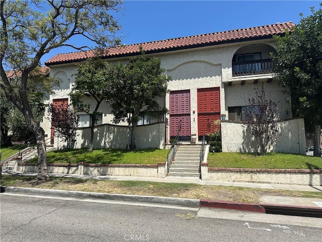 300 N Isabel St Unit 21, Glendale, CA 91206 - mediterranean / spanish-style house with stucco siding and a tiled roof