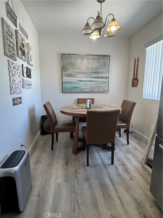300 N Isabel St Unit 21, Glendale, CA 91206 - dining space with wood finished floors and a chandelier