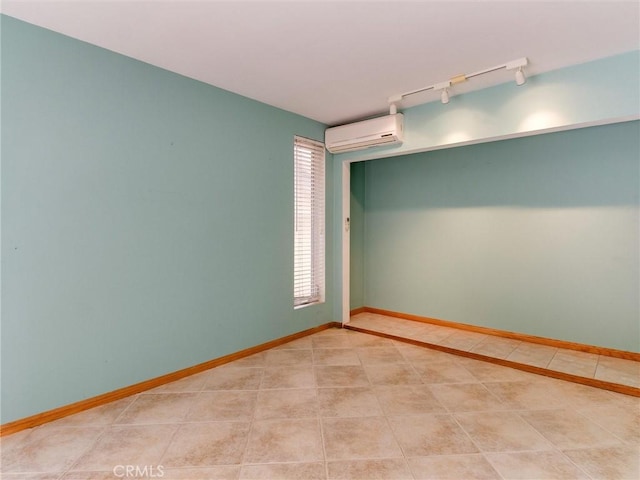 9386 Cambridge St, Cypress, CA 90630 - unfurnished room featuring a wall mounted AC, rail lighting, and light tile patterned flooring