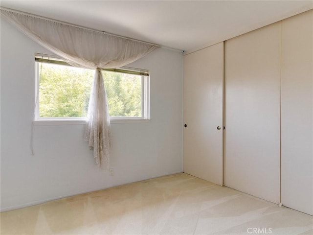 9386 Cambridge St, Cypress, CA 90630 - spare room with plenty of natural light and light carpet