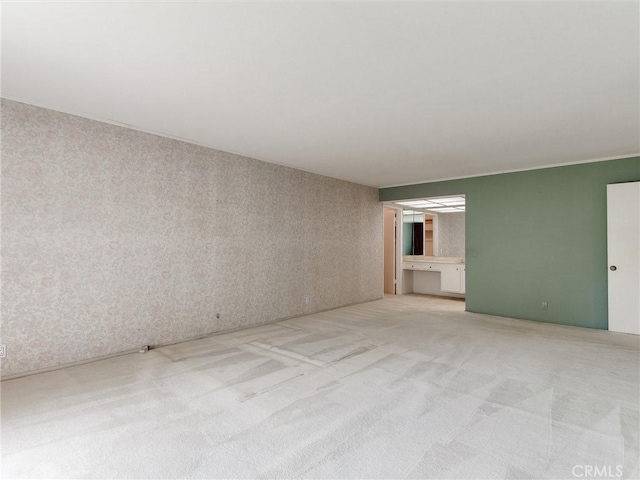 9386 Cambridge St, Cypress, CA 90630 - spare room with light carpet and wallpapered walls