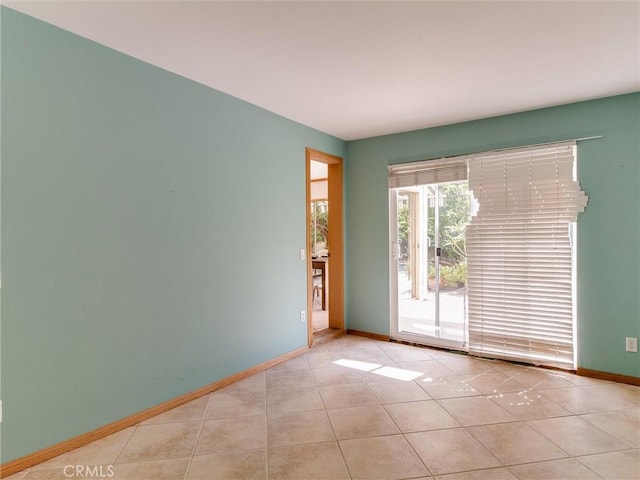 9386 Cambridge St, Cypress, CA 90630 - unfurnished room featuring baseboards and light tile patterned floors
