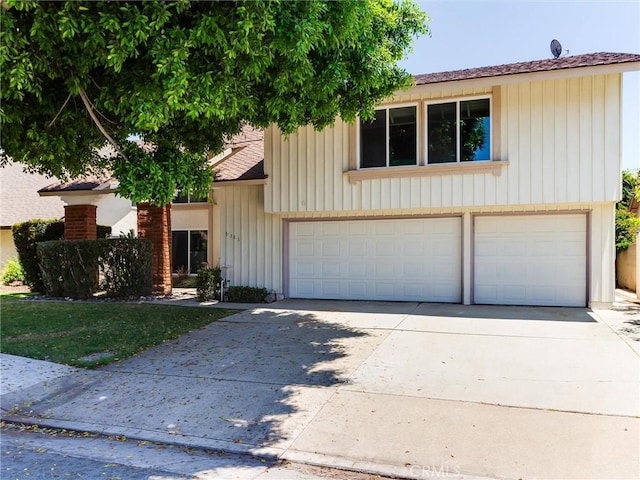 9386 Cambridge St, Cypress, CA 90630 - view of front of property featuring driveway and a garage