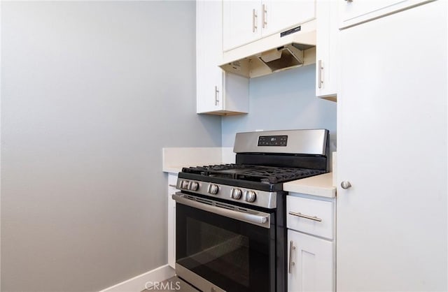 280 W S St, Rialto, CA 92376 - kitchen featuring gas stove, under cabinet range hood, white cabinetry, and light countertops