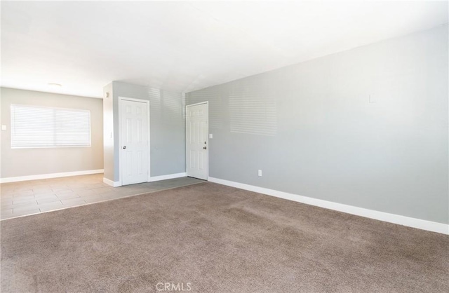 280 W S St, Rialto, CA 92376 - tiled spare room with carpet flooring and baseboards