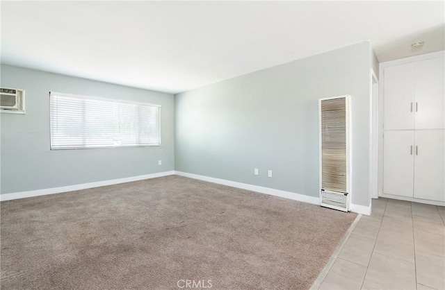 280 W S St, Rialto, CA 92376 - spare room featuring a heating unit, light tile patterned floors, a wall mounted air conditioner, and a smoke detector