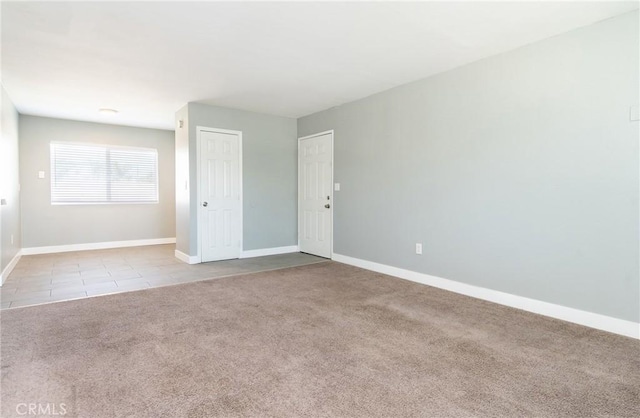 280 W S St, Rialto, CA 92376 - tiled empty room with carpet and baseboards