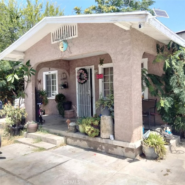 188 E Temple St, San Bernardino, CA 92410 - view of front of house featuring stucco siding and covered porch