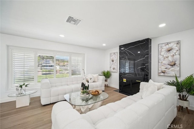 19040 Celtic St, Porter Ranch, CA 91326 - living room featuring wood finished floors and recessed lighting