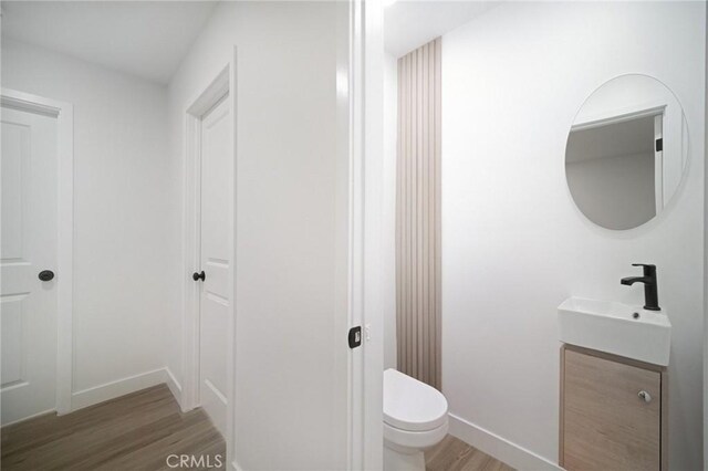 19040 Celtic St, Porter Ranch, CA 91326 - bathroom with wood finished floors and vanity