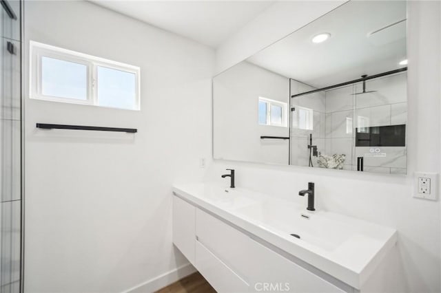 19040 Celtic St, Porter Ranch, CA 91326 - bathroom with plenty of natural light, a stall shower, double vanity, recessed lighting, and wood finished floors
