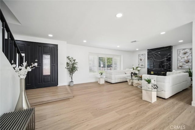 19040 Celtic St, Porter Ranch, CA 91326 - living area featuring light wood finished floors, recessed lighting, and stairs