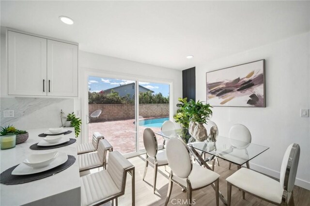 19040 Celtic St, Porter Ranch, CA 91326 - dining area with light wood-style floors and recessed lighting