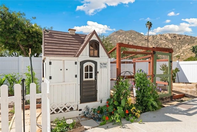 330 Spruce St, Riverside, CA 92507 - view of shed featuring a mountain view and a fenced backyard