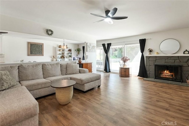 330 Spruce St, Riverside, CA 92507 - living room featuring wood finished floors, a ceiling fan, and a fireplace
