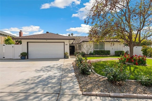 330 Spruce St, Riverside, CA 92507 - single story home with a gate, a garage, concrete driveway, stucco siding, and a chimney