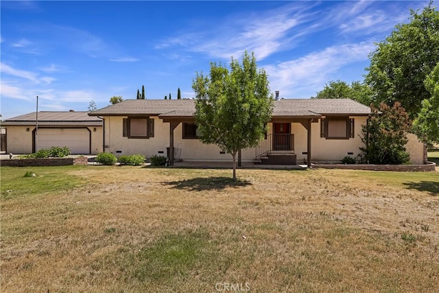 8140 Sherwood Blvd, Los Molinos, CA 96055 - ranch-style home featuring a front yard, an attached garage, and stucco siding
