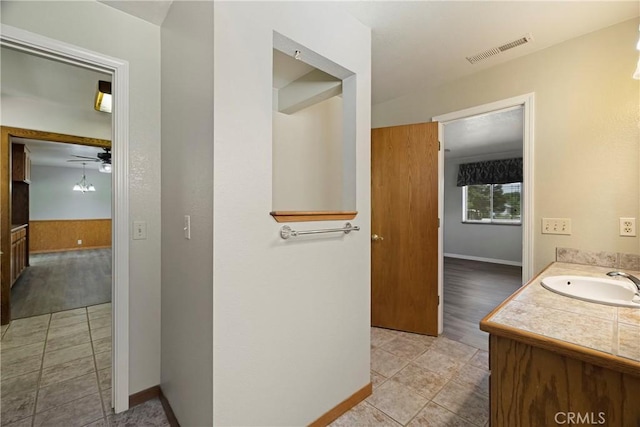 8140 Sherwood Blvd, Los Molinos, CA 96055 - bathroom featuring vanity, tile patterned flooring, and a ceiling fan