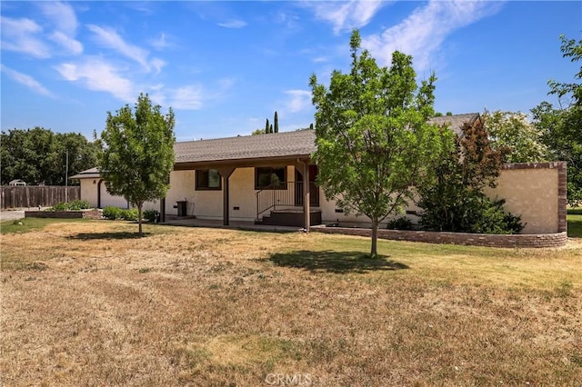 8140 Sherwood Blvd, Los Molinos, CA 96055 - rear view of house featuring stucco siding and an attached garage