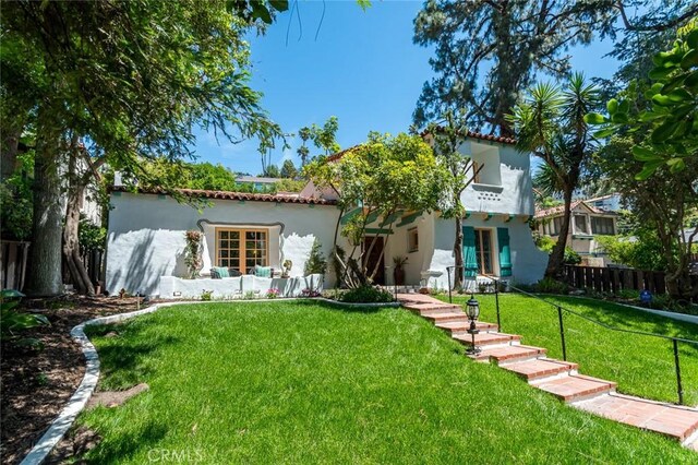 611 E Mountain St, Glendale, CA 91207 - back of house with stucco siding and a tile roof