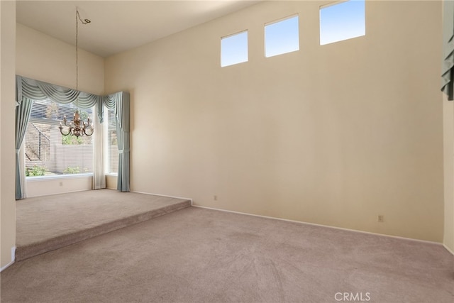 15280 Dunes Way, Moreno Valley, CA 92555 - unfurnished room featuring carpet and a chandelier