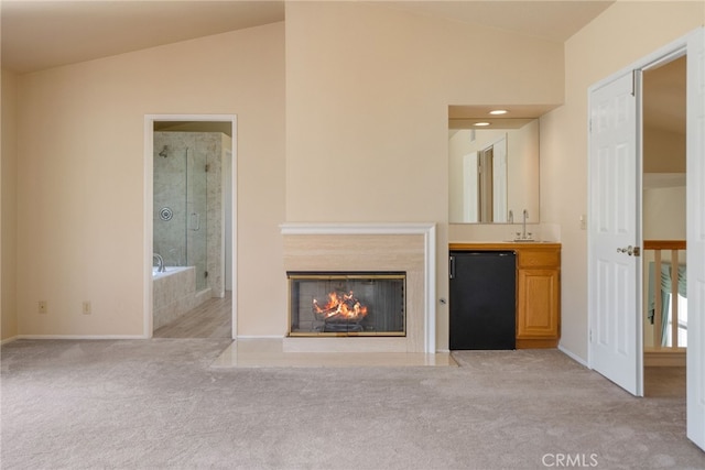 15280 Dunes Way, Moreno Valley, CA 92555 - unfurnished living room featuring lofted ceiling, carpet floors, and a glass covered fireplace