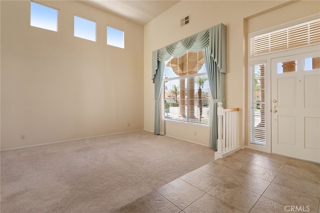 15280 Dunes Way, Moreno Valley, CA 92555 - carpeted entryway with baseboards and a high ceiling