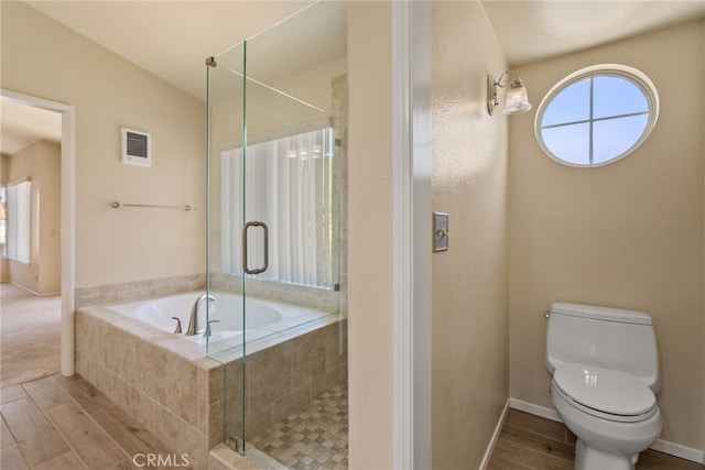 15280 Dunes Way, Moreno Valley, CA 92555 - full bath featuring wood finished floors, healthy amount of natural light, and a stall shower
