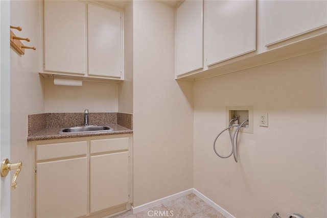 15280 Dunes Way, Moreno Valley, CA 92555 - laundry room with washer hookup, cabinet space, light tile patterned floors, and bar with sink