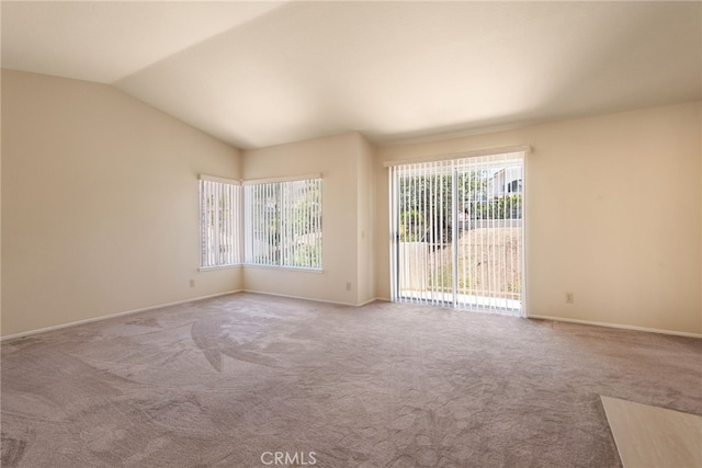 15280 Dunes Way, Moreno Valley, CA 92555 - carpeted empty room with vaulted ceiling and baseboards