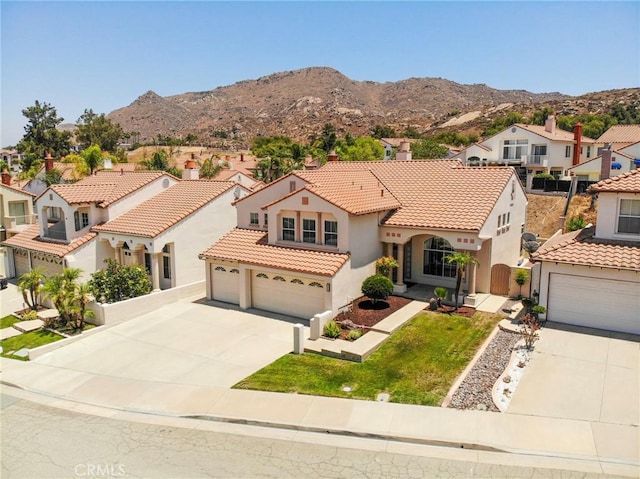 15280 Dunes Way, Moreno Valley, CA 92555 - mediterranean / spanish house with concrete driveway, stucco siding, a residential view, and a tile roof