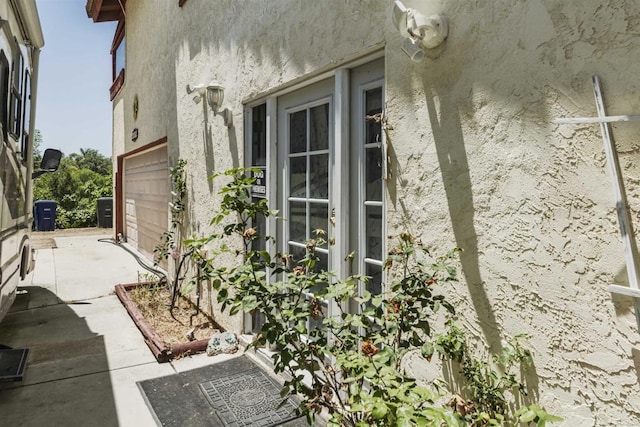 3329 Mandy Ln, Spring Valley, CA 91977 - view of home's exterior featuring stucco siding and a garage