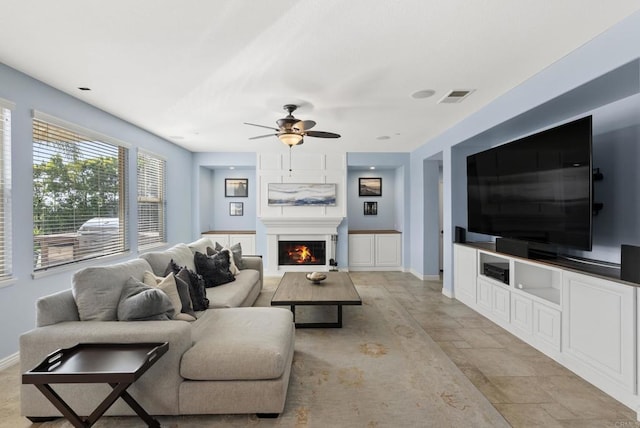 11550 Carowind Ln, Scripps Miramar, CA 92131 - living area with a ceiling fan and a lit fireplace